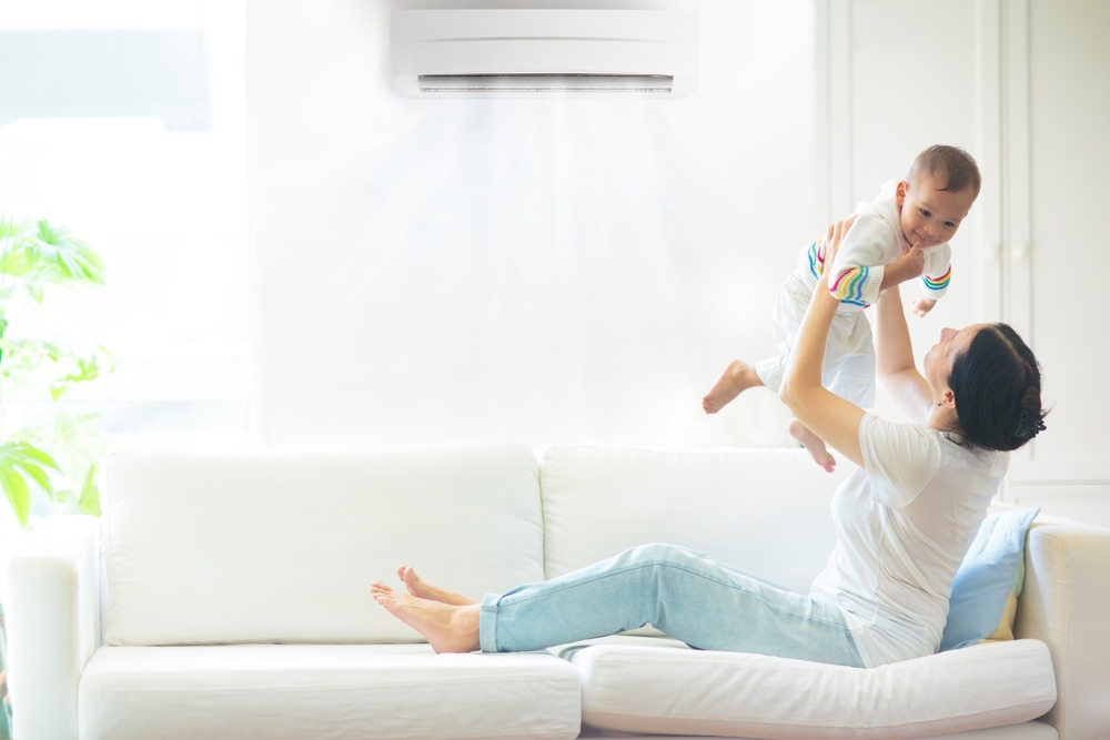 mother and baby under air conditioner